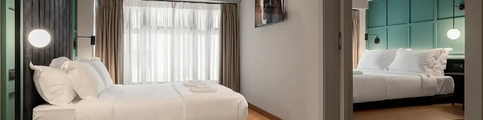 a bedroom with a mirror and a bed