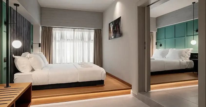 a bedroom with a mirror and a bed