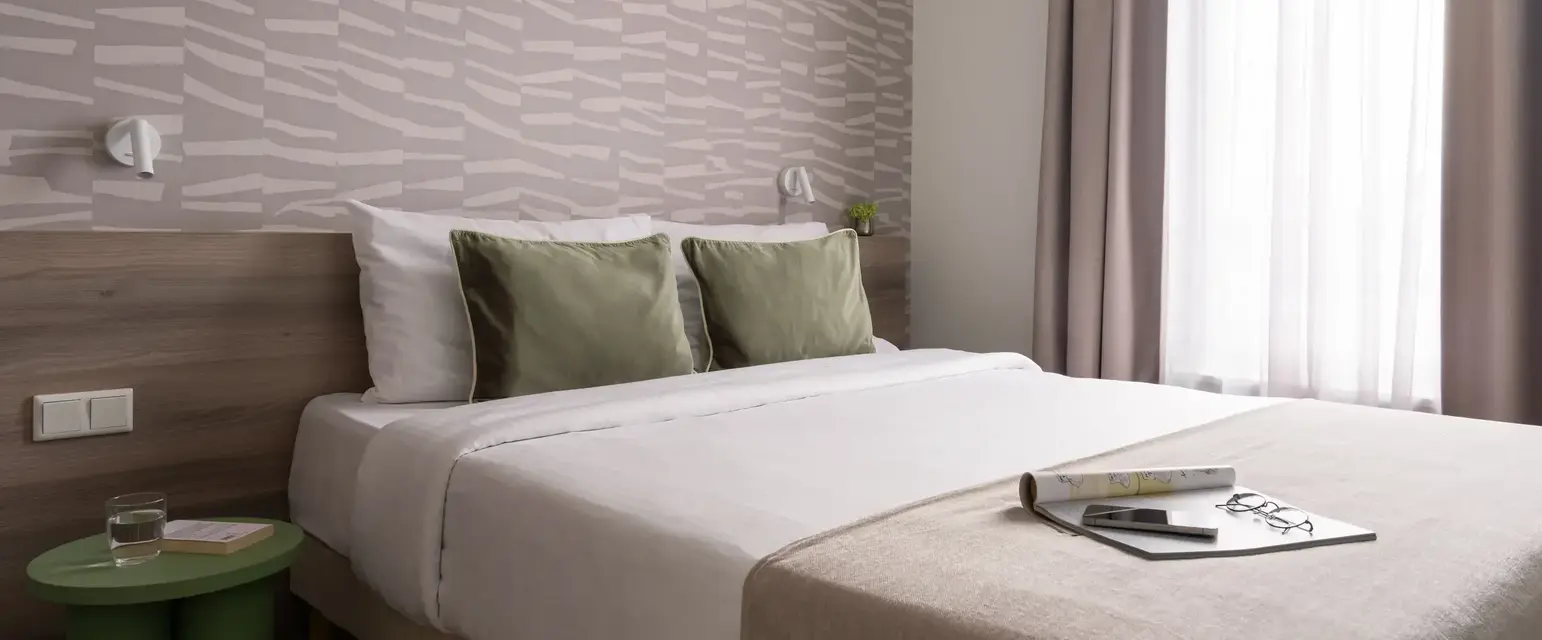 a bed with a book on it