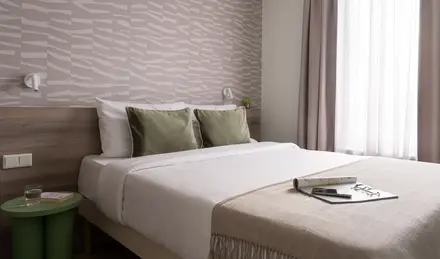 a bed with a book on it