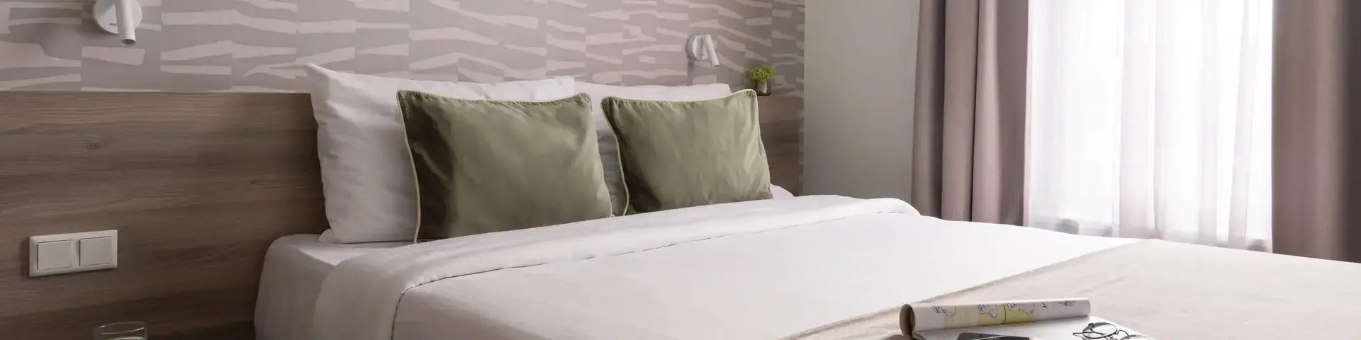 a bed with a book on it