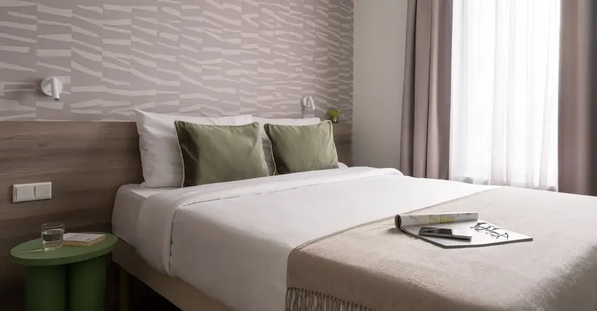 a bed with a book on it