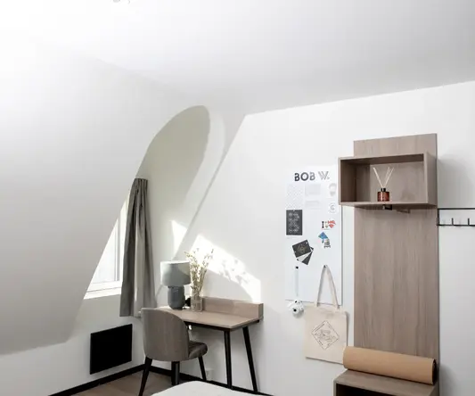 a room with a desk and chair