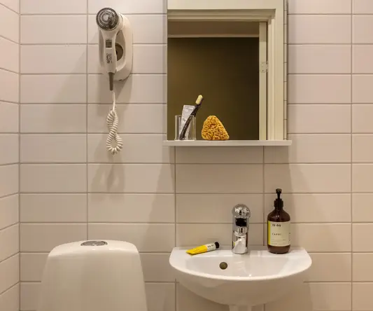 a bathroom with a mirror and sink