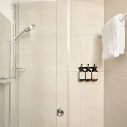 a white towel on a rack in a bathroom