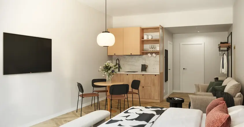 a room with a bed and a table and chairs