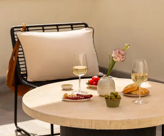 a table with food and wine glasses on it