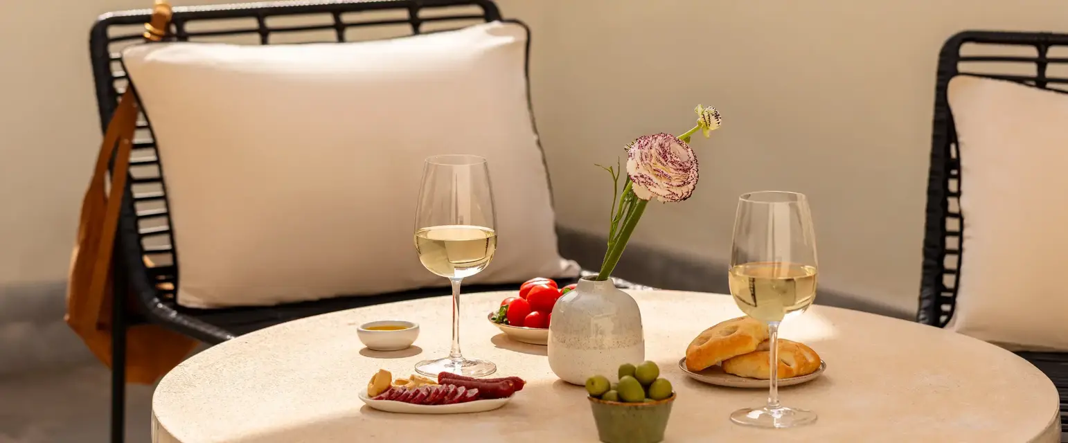 a table with food and wine glasses on it