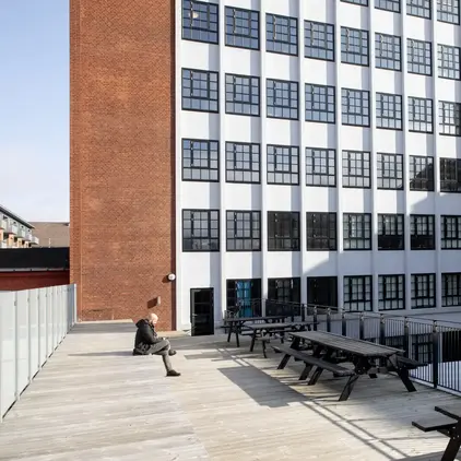 a building with many tables and benches