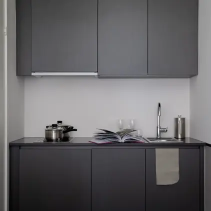 a kitchen with a book and a sink