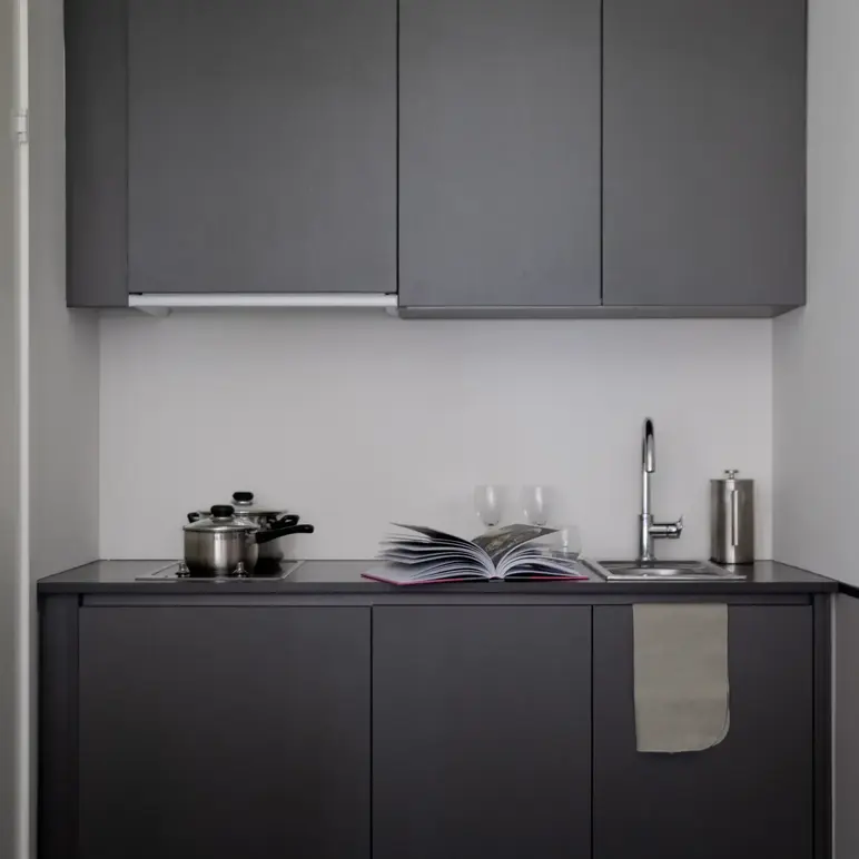 a kitchen with a book and a sink