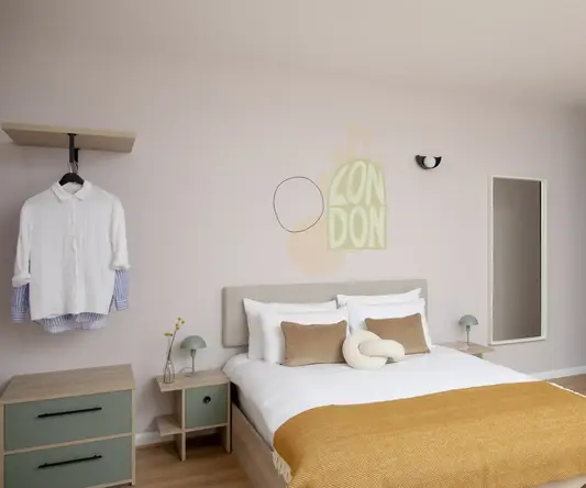 a bedroom with a bed and a mirror