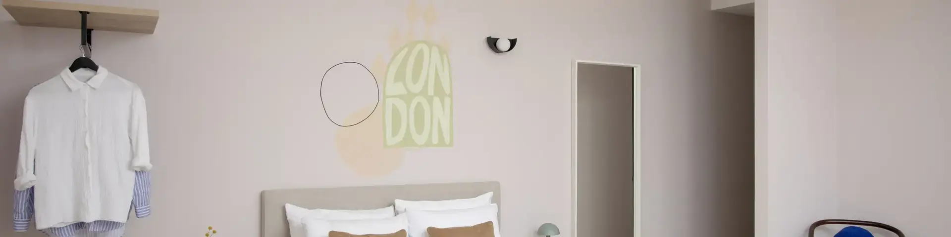 a bedroom with a bed and a mirror