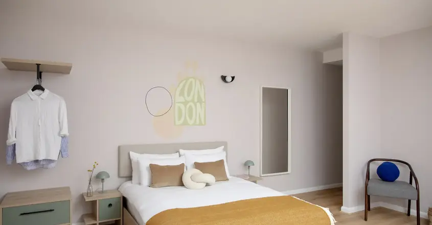 a bedroom with a bed and a mirror