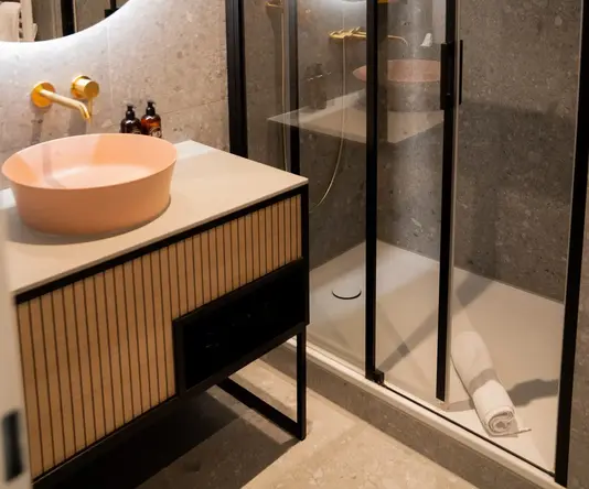 a bathroom with a shower and sink