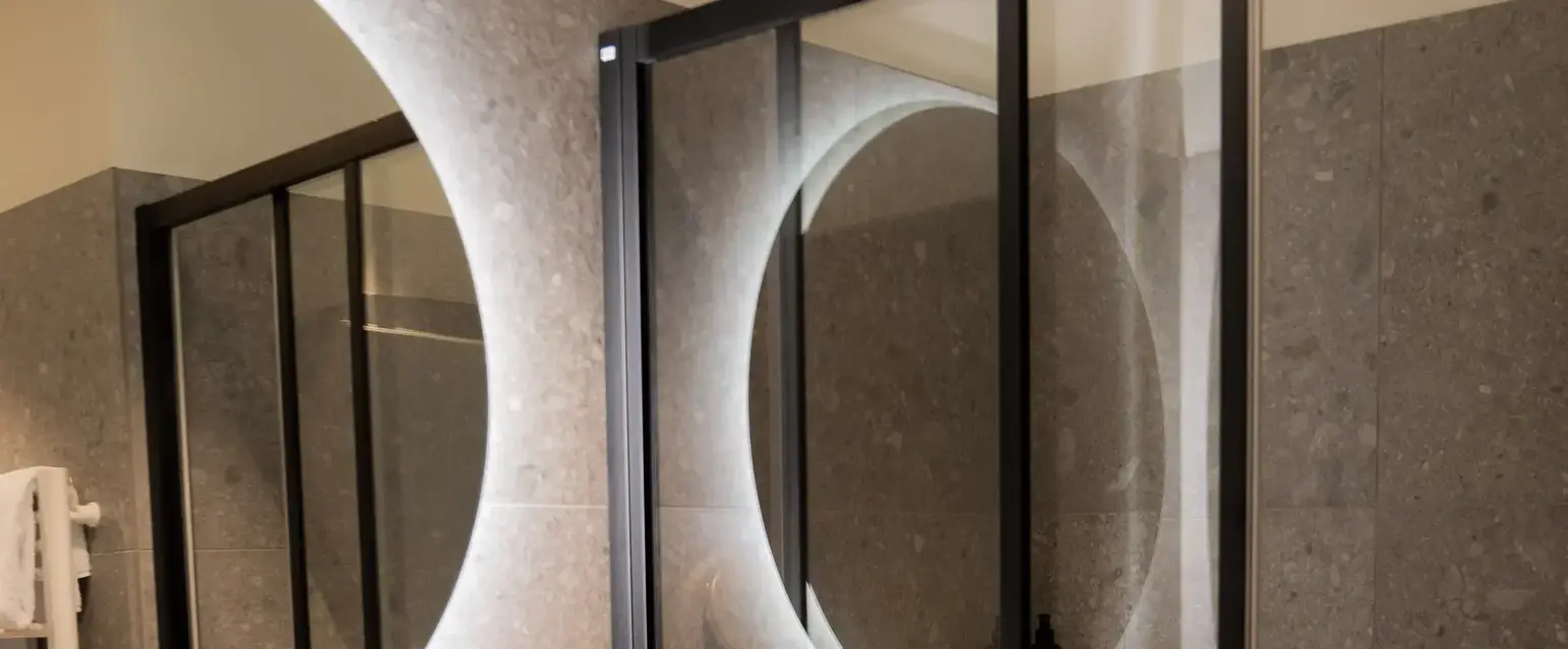 a bathroom with a shower and sink