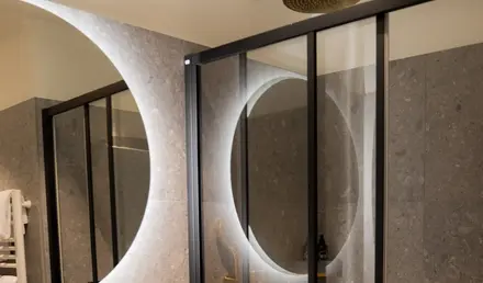 a bathroom with a shower and sink