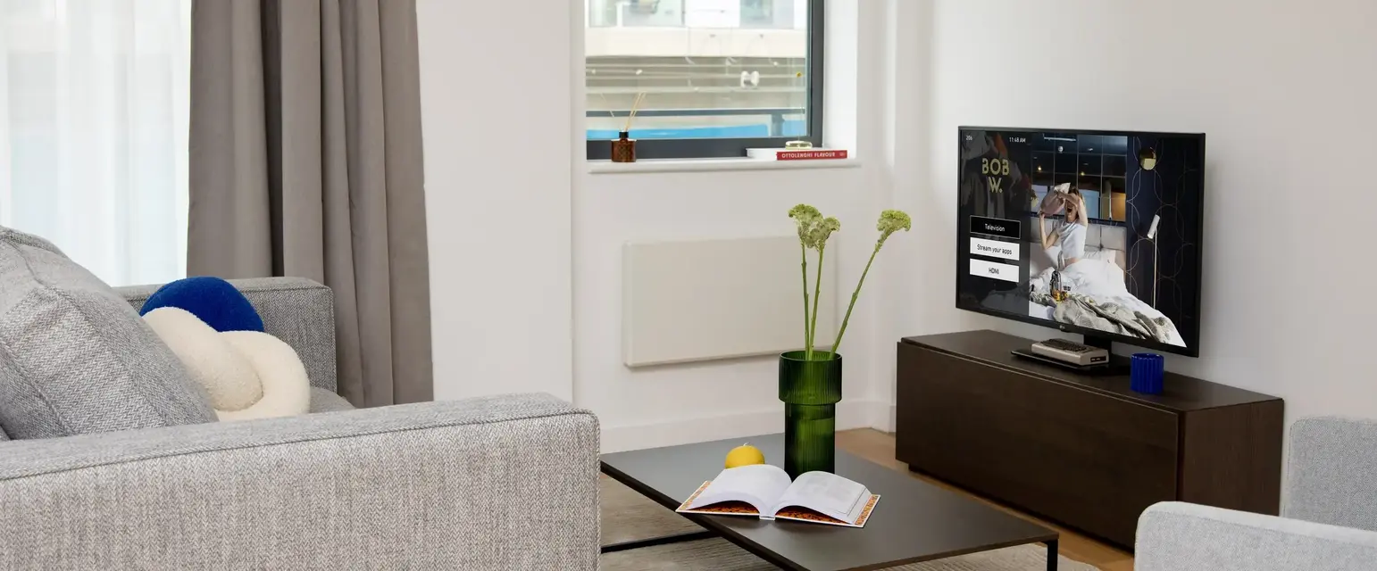 a living room with a television and a couch