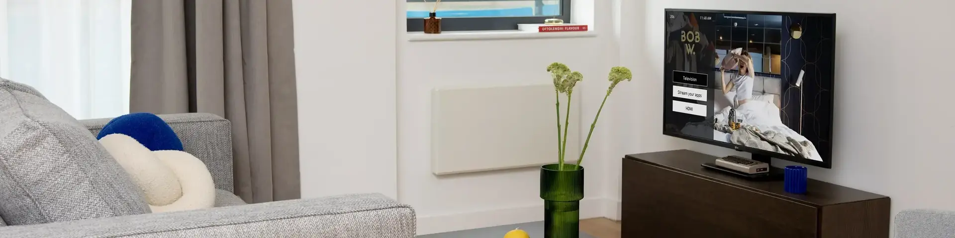 a living room with a television and a couch