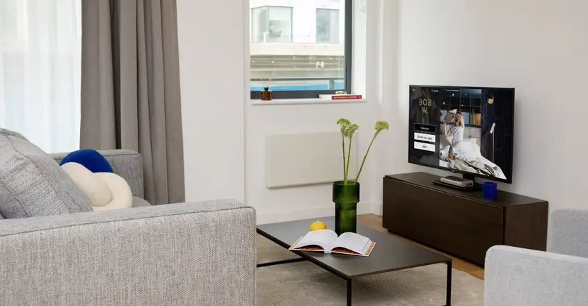 a living room with a television and a couch