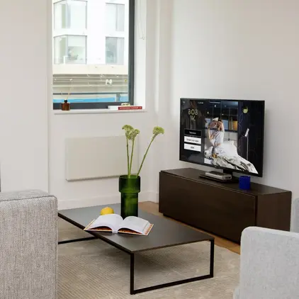 a living room with a television and a couch