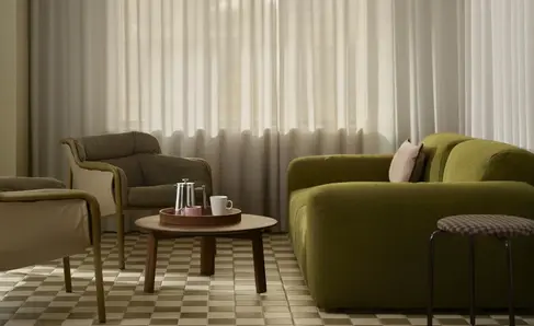 a living room with a couch and chairs