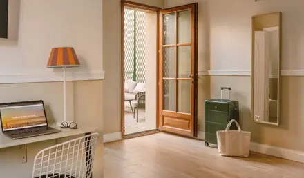 a room with a desk and a computer