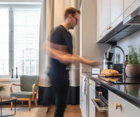 a man standing in a kitchen