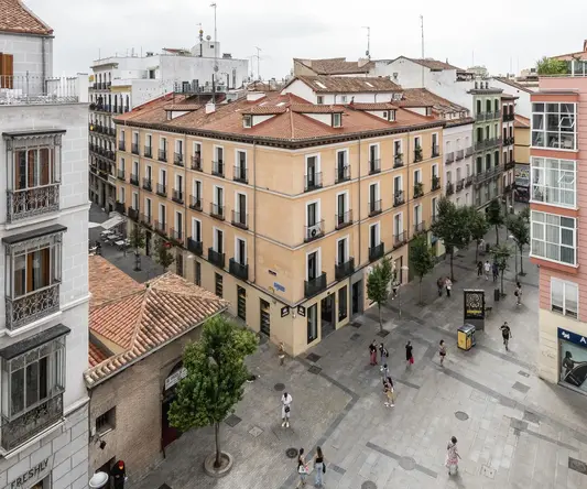 a group of people walking in a city