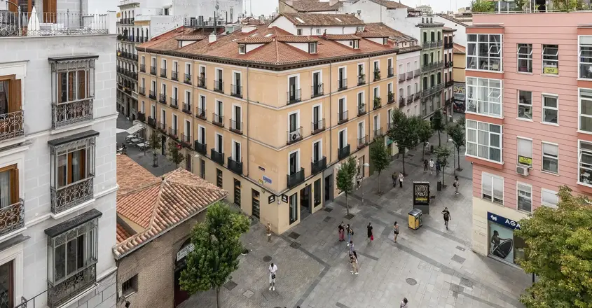 a group of people walking in a city