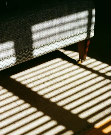 a shadow of a couch on the floor