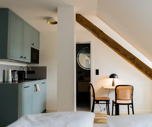 a room with a table and chairs