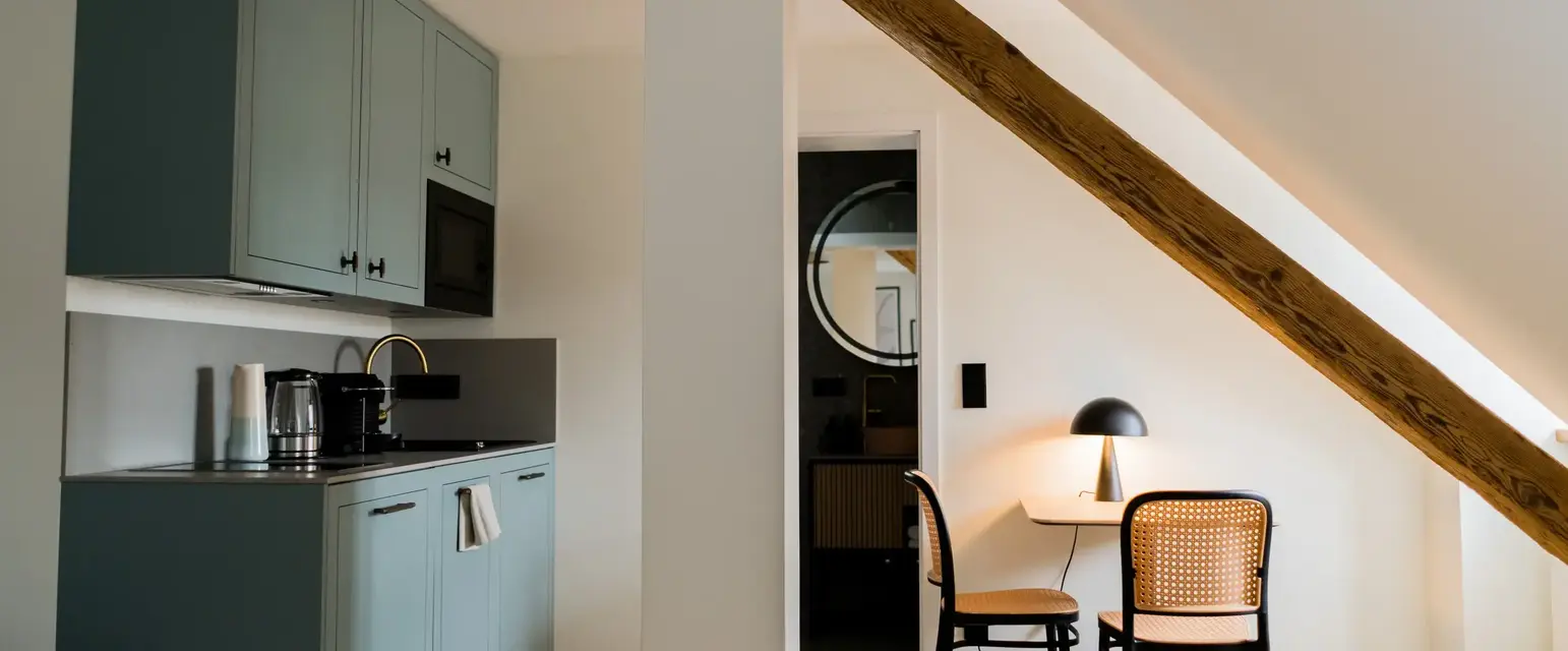 a room with a table and chairs