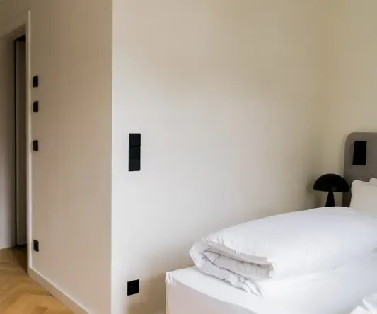 a white bed in a room