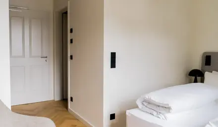 a white bed in a room