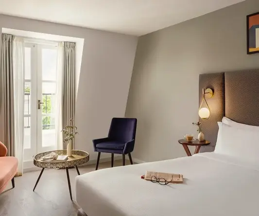 a room with a bed and a chair