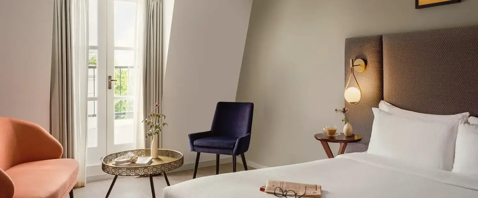 a room with a bed and a chair