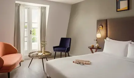 a room with a bed and a chair