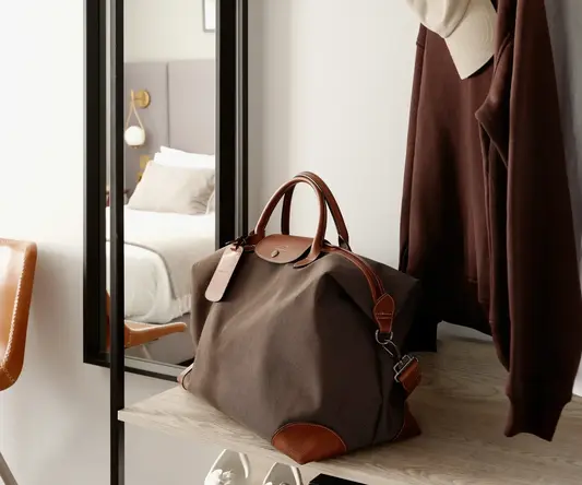 a bag and a coat on a rack