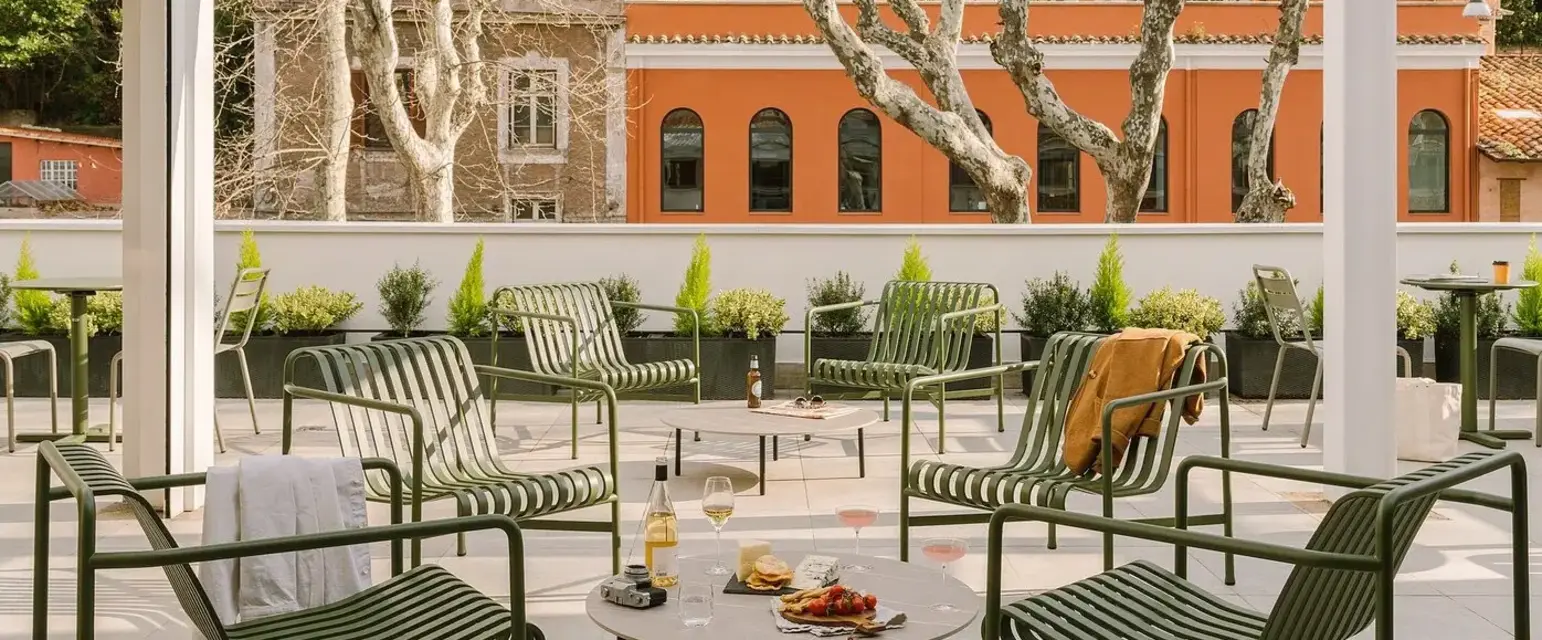 a patio with a table and chairs