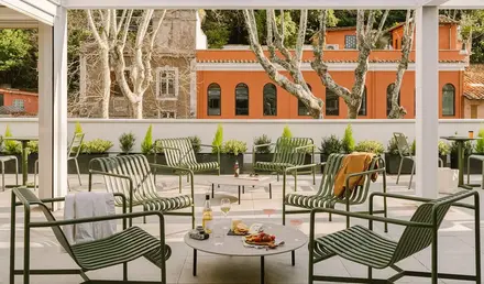 a patio with a table and chairs