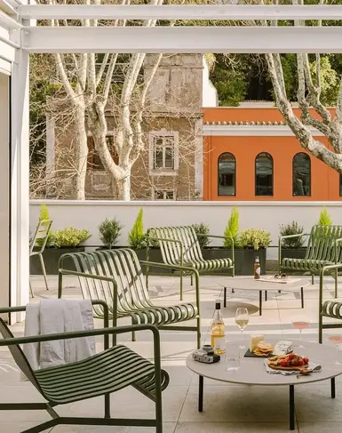 a patio with a table and chairs