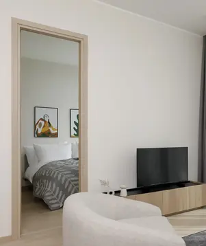a room with a television and a bed
