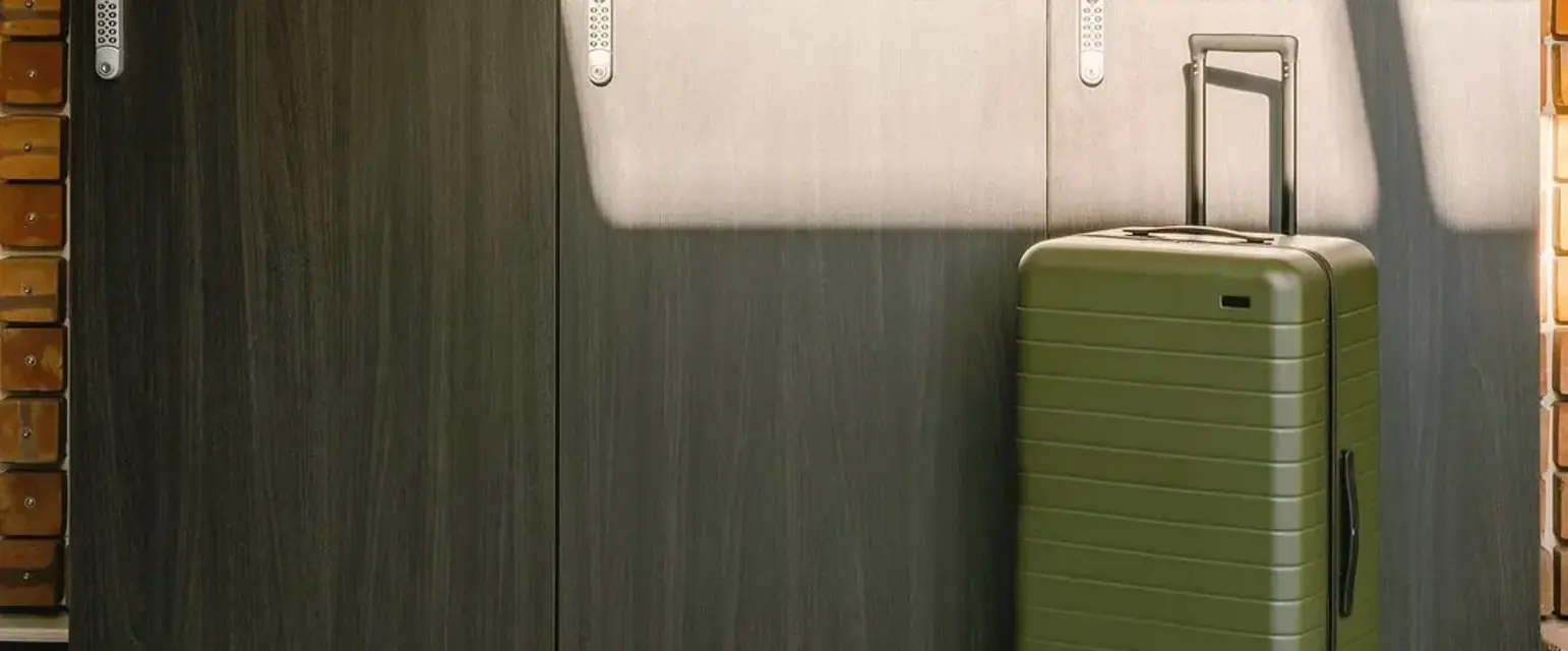 a suitcase in front of lockers