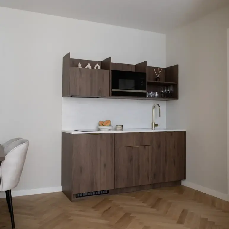 a kitchen with a sink and a microwave