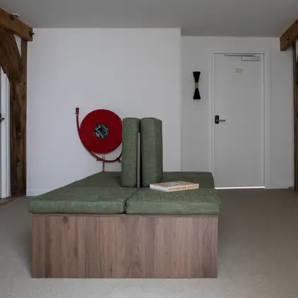 a room with a couch and a door