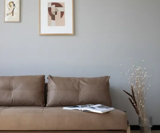 a couch with a magazine on it