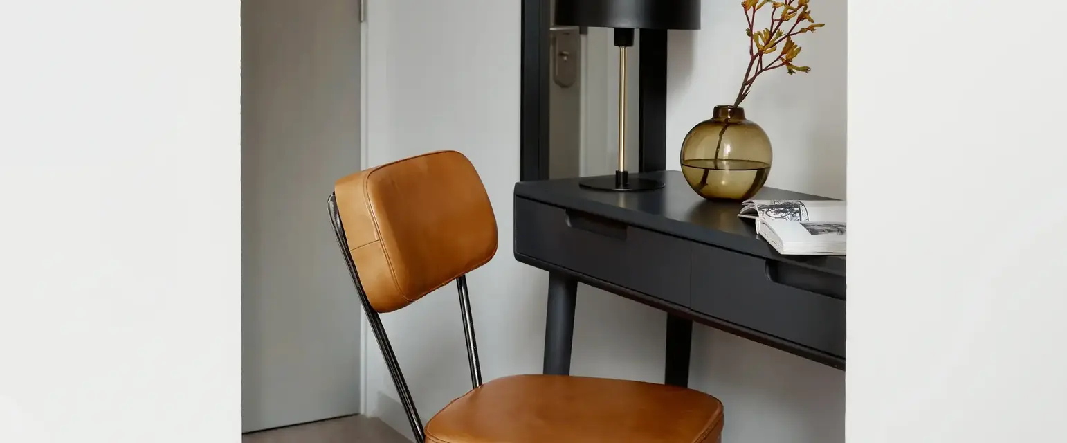 a chair next to a desk