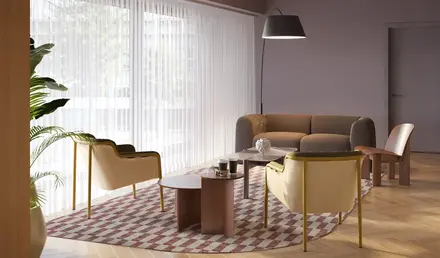 a room with a couch and chairs