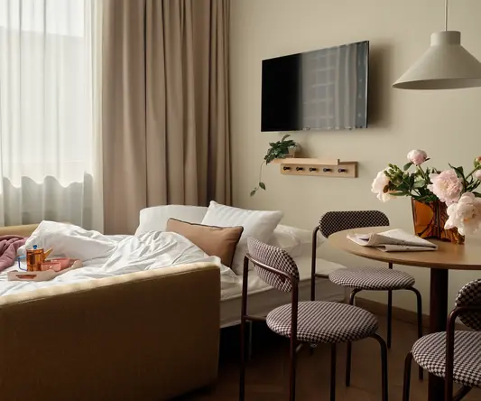 a room with a tv and a bed